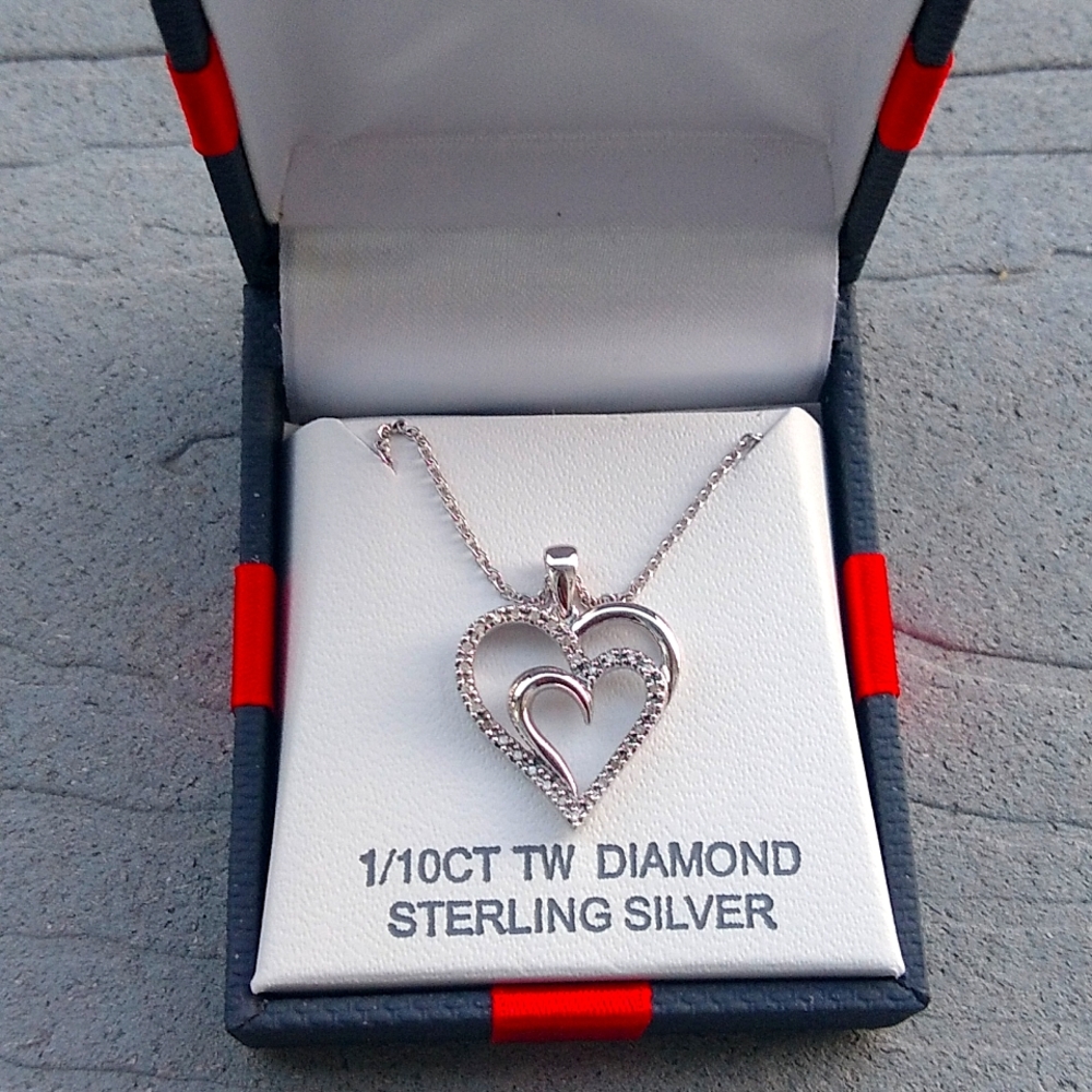 Sterling silver heart pendant with diamonds